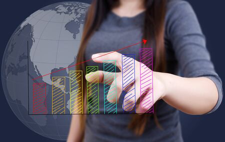 Business lady pushing graph for trade stock market on the whiteboard の写真素材