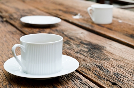 Coffee cup on the wood texture.の写真素材