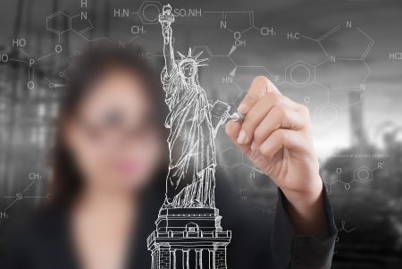 Business Lady drawing Statue of Liberty in USA for Independence Day, 4 th of July の写真素材