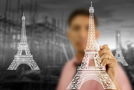 Businessman drawing Eiffel Tower line  in Paris for construction の写真素材
