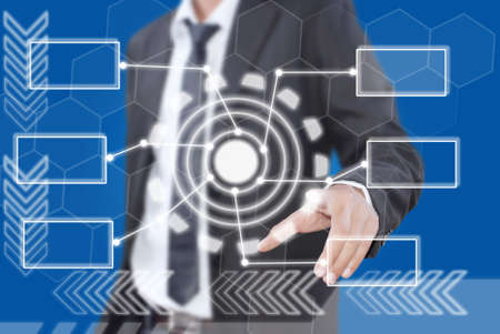 Businessman pushing digital button on touch screen interface の写真素材