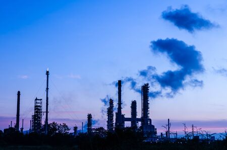 Oil refinery plant silhouette at twilight dark blue sky の写真素材