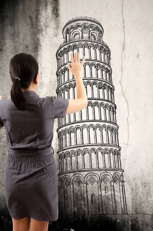 Business Lady pushing Pisa Tower line  in Italy for construction の写真素材