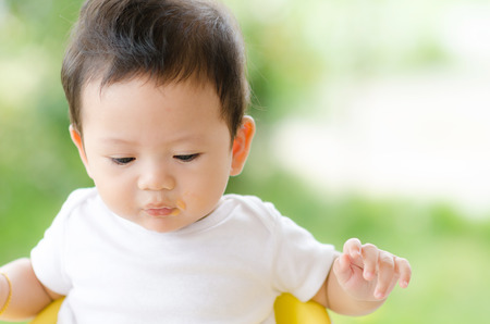 Little Baby Boy Eating in the Park.の写真素材