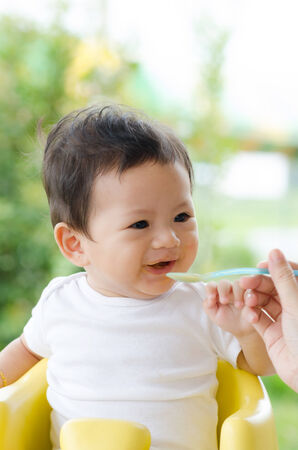 Little Baby Boy Eating in the Park.の写真素材