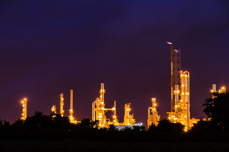 Oil refinery plant at twilight dark blue sky.