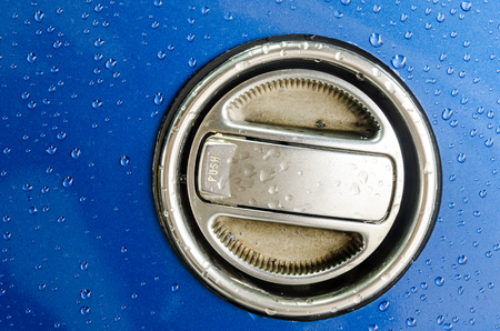 Fuel Gas Cap on the blue field, Texture Background.の写真素材