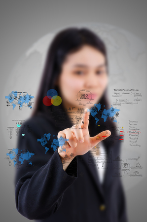 Businesswoman touching Business icons and Technology icons for technology and business concept.の写真素材