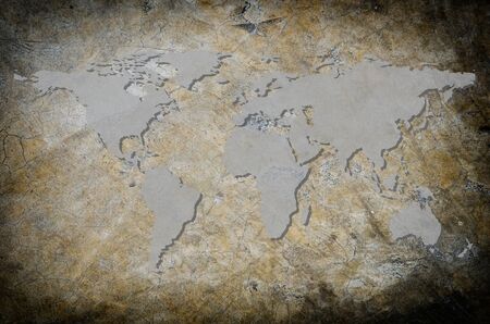 World map carving on wood plank.