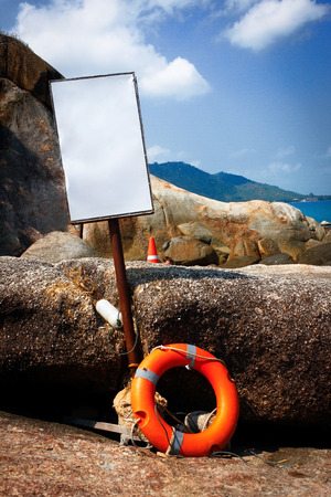Life ring with a warning signの写真素材