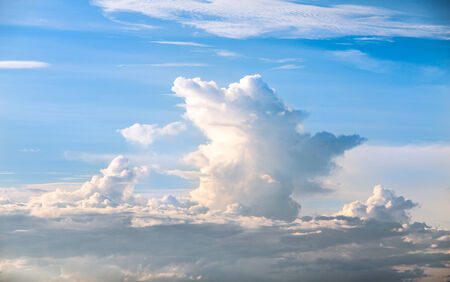 White cumulus clouds and a blue skyの写真素材