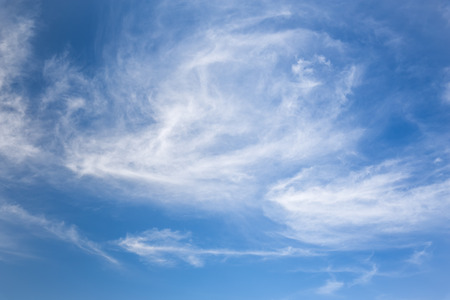beautiful white fluffy clouds in the blue skyの写真素材