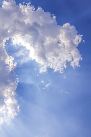 Light beam with white cloud on skyの写真素材