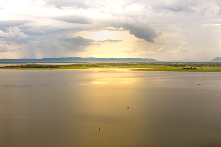 Wonderful sunset after the rain at reservoir, Thailandの写真素材