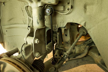 Changing car Stabilizer control link at my home.の写真素材