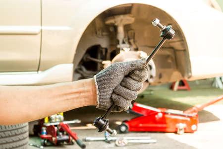 Hand with Car Stabilizer control link, Close up.の写真素材