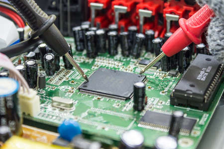 DVD Player motherboard repair close-up, electronic hardware concept.の写真素材