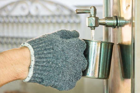 Break from work and Take water from the cooler.の写真素材