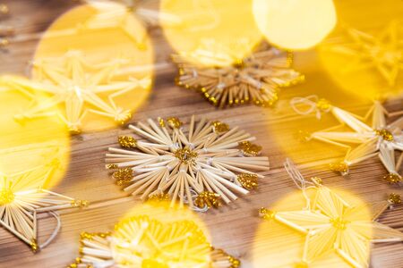 Christmas straw stars on wooden vintage backgroundの写真素材
