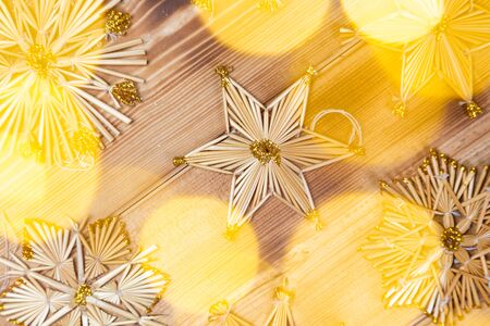 Christmas straw stars on wooden vintage backgroundの写真素材
