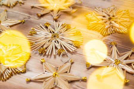Christmas straw stars on wooden vintage backgroundの写真素材