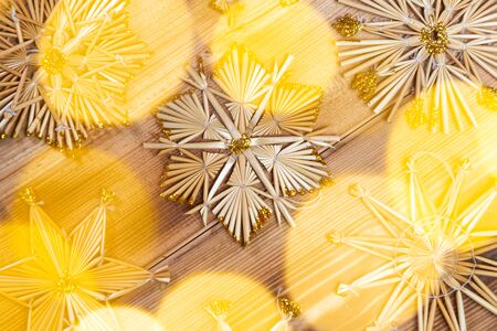 Christmas straw stars on wooden vintage backgroundの写真素材