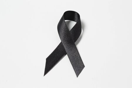 A black awareness ribbon isolated on white backgroundの写真素材