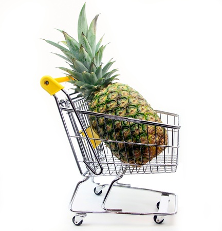 Pineapple in shopping cartの写真素材