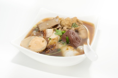 Boiled Chinese pasta squares ; paste of rice flour  Sweet Chinese Pasta with pork entrails stewed in...