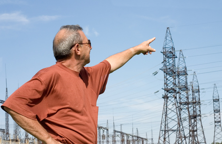 The man on a background of electric substationの写真素材