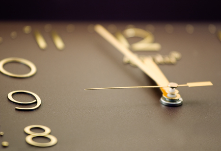 Hours showing five minutes to twelveの写真素材