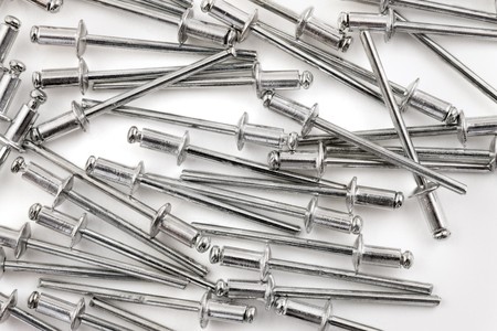 Aluminium rivets on a white backgroundの写真素材