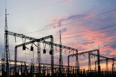 Electric substation on a background of the coming sunの写真素材