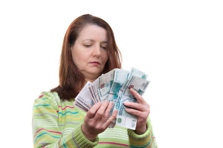 woman counts the money - isolated on white backgroundの写真素材