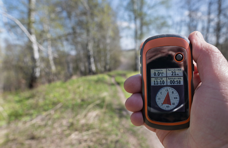 tourist navigator in hand tourist, defining their wayの写真素材