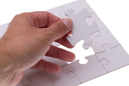 Hand holding the missing puzzle brickの写真素材