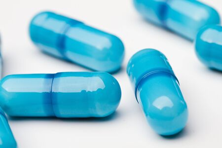 Blue medicine capsules closeupの写真素材