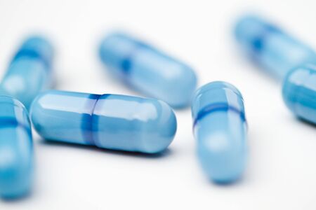 Blue medicine capsules closeupの写真素材