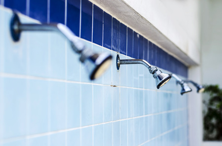 A faucet place on ceramic tile wallの写真素材