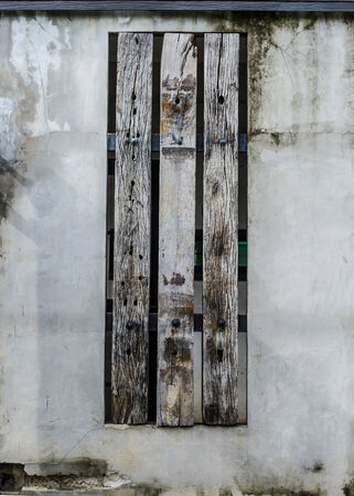 Old railway sleepers have decorated on concrete wallの写真素材