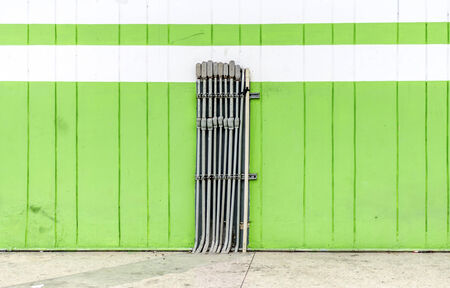 An image of small pipeline on greenwallの写真素材