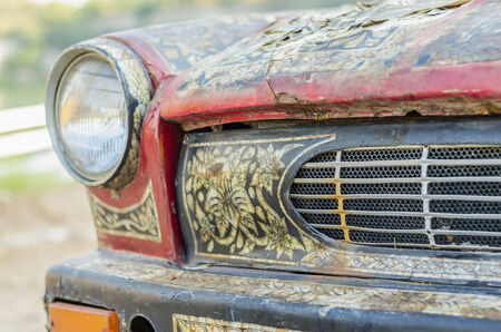 SARABURI PROVINCE, THAILAND - DECEMBER 10 2014 : An old car which decorated by Thai pattern parked on display at the flooding market named " Baan nok " loacted in Saraburi, Thailandのeditorial素材