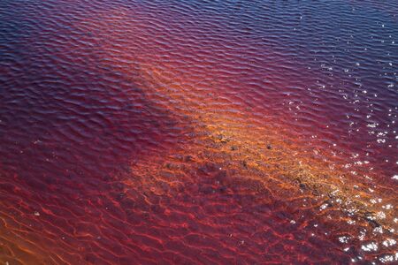 Wind on the red water in lignit mineの写真素材