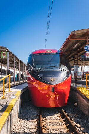 KAWAGUCHIKO,JAPAN 14 MAR 2019 Red color train Fujisan view express from Otsuki station parking at Kawaguchiko Station on a clear blue sky dayのeditorial素材