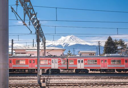 KAWAGUCHIKO,JAPAN 14 MAR 2019 -Mt. Fuji and Red Swiss-Japan Train park at Kawaguchiko Stationのeditorial素材