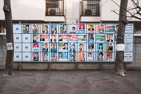 TOKYO,JAPAN MARCH 12 2019 Politicians on a political campaign poster at public playgroundのeditorial素材