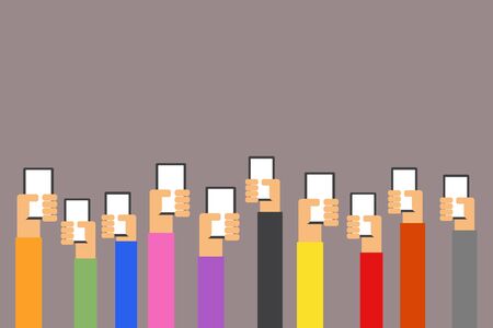 Group of people's hands holding phones and rising them up with Multicolor shirt isolated on dark...