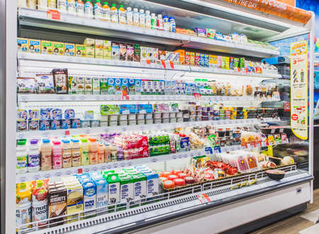HANOI,VIETNAM - March 1,2021 -Variety of Drinking yogurt, soy milk,milk,pudding and healthy drink on Freezer shelves at convenience storeのeditorial素材
