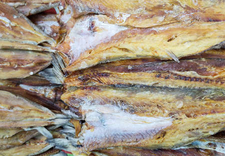 Dried sliced fish close up view.Dried fish in an Asian market.の写真素材