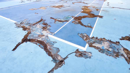 Close up of Ruined outdoor blue color Tennis cort backgroundの写真素材